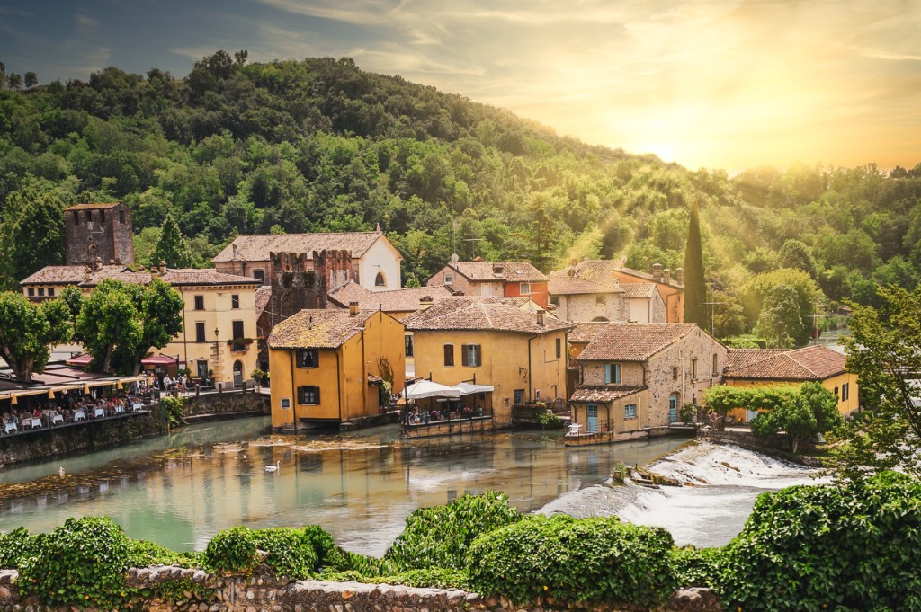 Borghetto sul Mincio: medieval mills and village on the river Mincio with waterfall and green hills