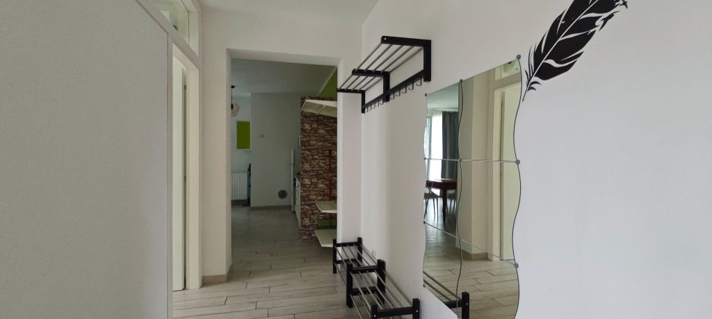 Apartament 1.Verde — korytarz wejściowy do salonu